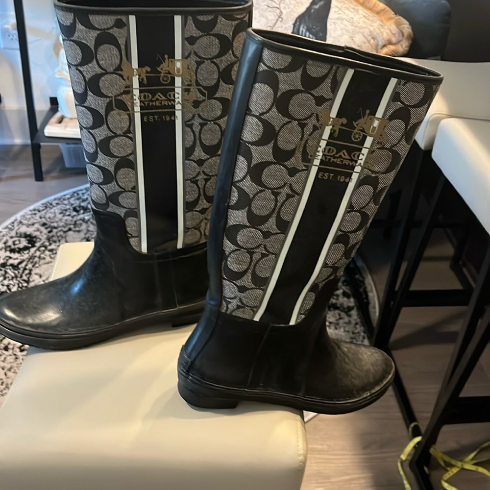 Coach rain boots never worn - they were to tight for me .